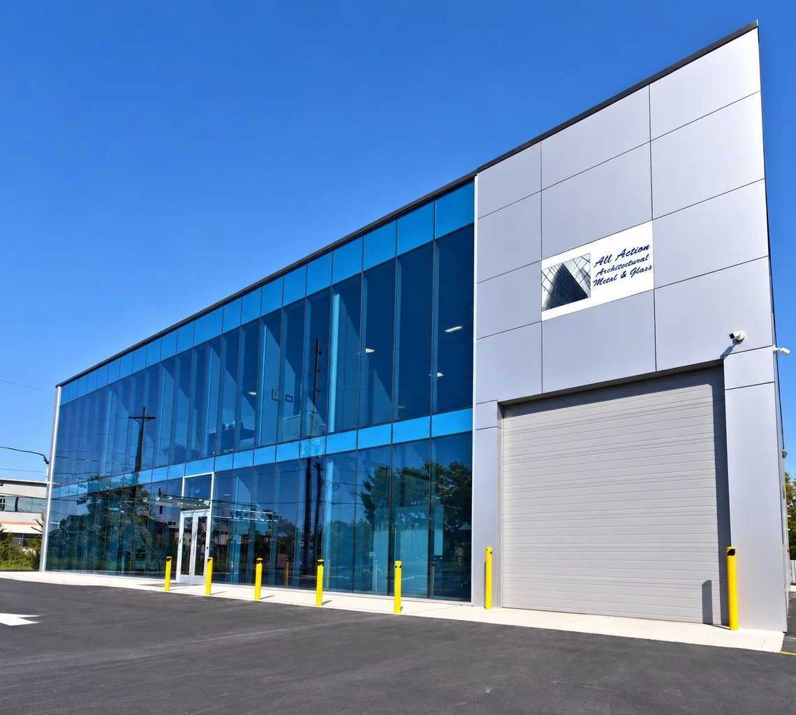 All Action Architectural Metal & Glass building with its blue glass facade and white exterior panels
